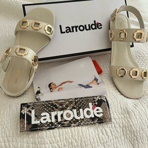 Larroude white sandals with gold design